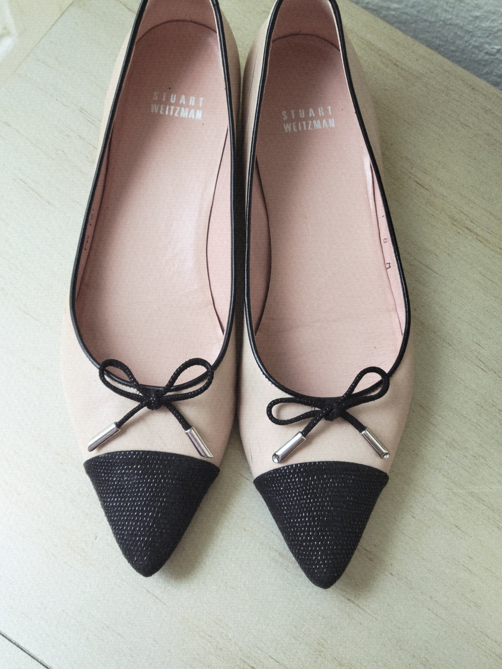 Stuart Weitzman Cream and Black Pointed Toe Bow Flats